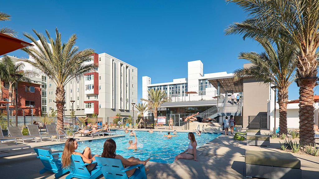 People sitting around a pool.