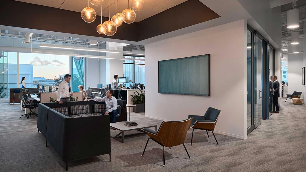 A room with people and chairs.