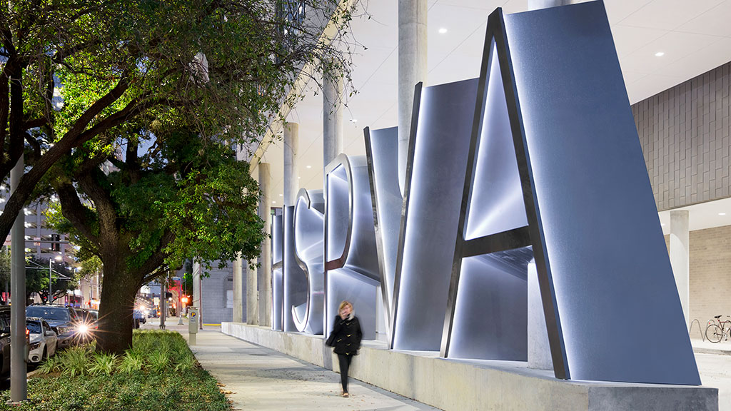 A person walking on a sidewalk.