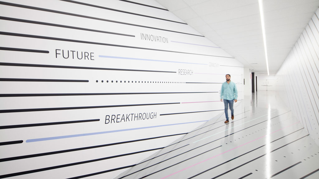 A person walking in a hallway.