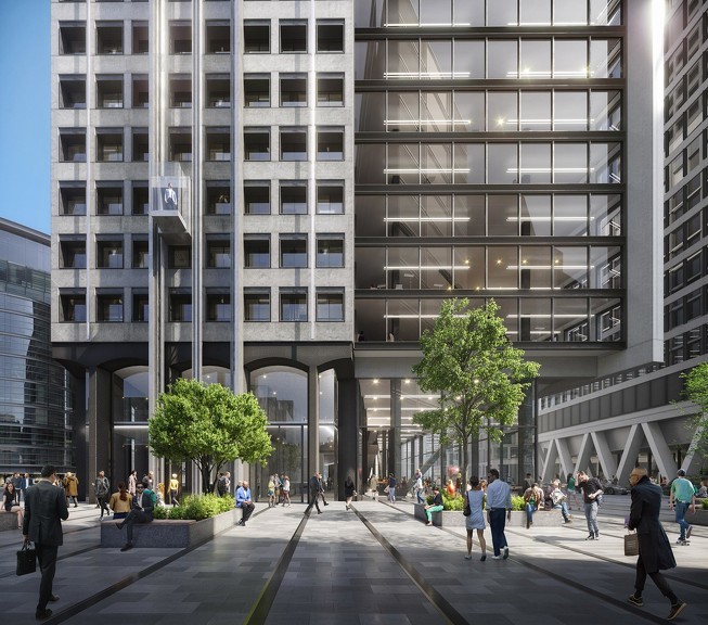 A group of people walking outside of a building.