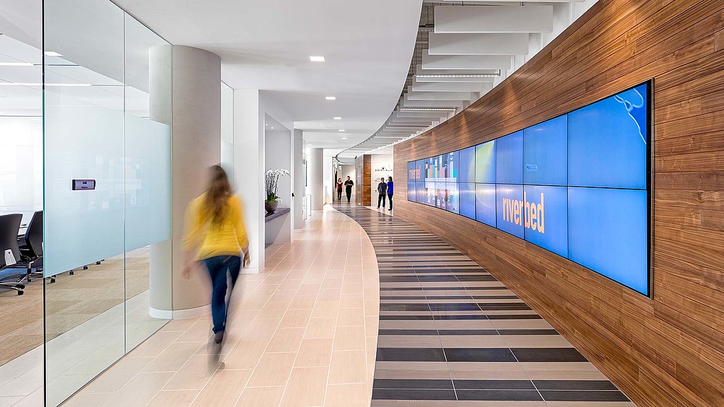 A person walking in a hallway.