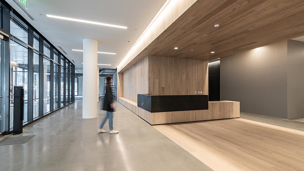 A person walking in a large room.