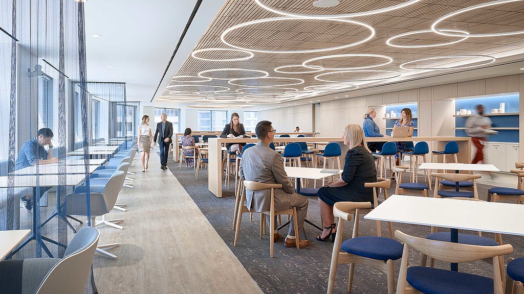 People sitting at tables in a room.