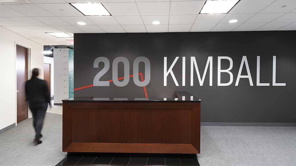 A person walking in a hallway.