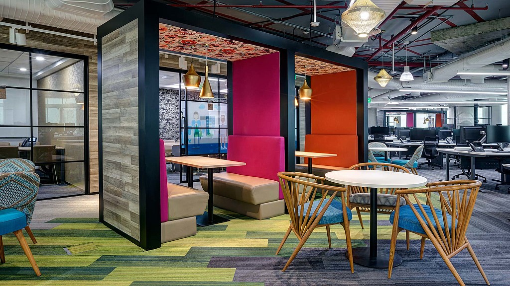 A room with tables and chairs.