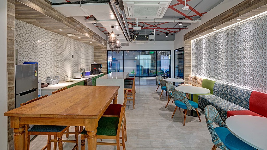 A room with tables and chairs.