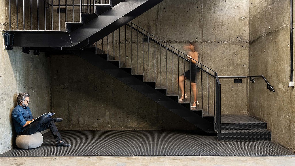 A man sitting on a staircase.