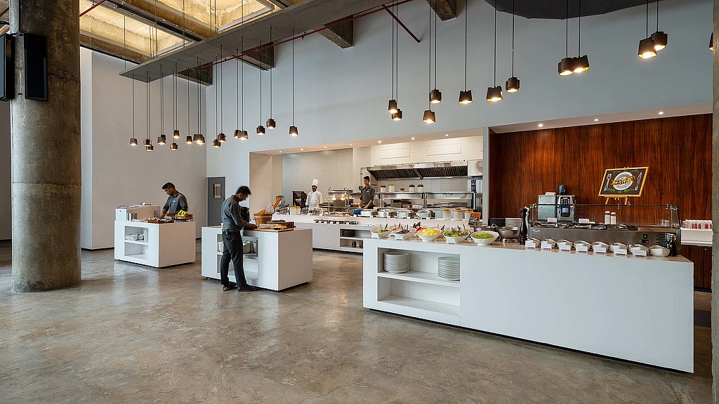 A kitchen with a large counter.