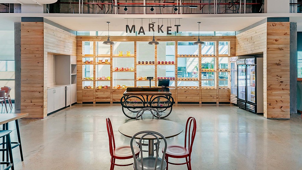 A room with tables and chairs.