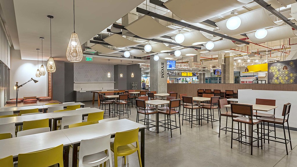 A room with tables and chairs.