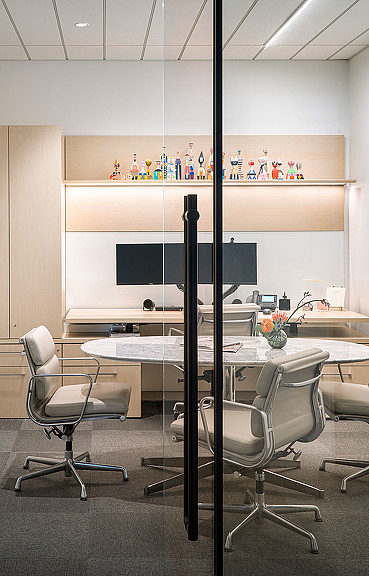 A room with a table and chairs.