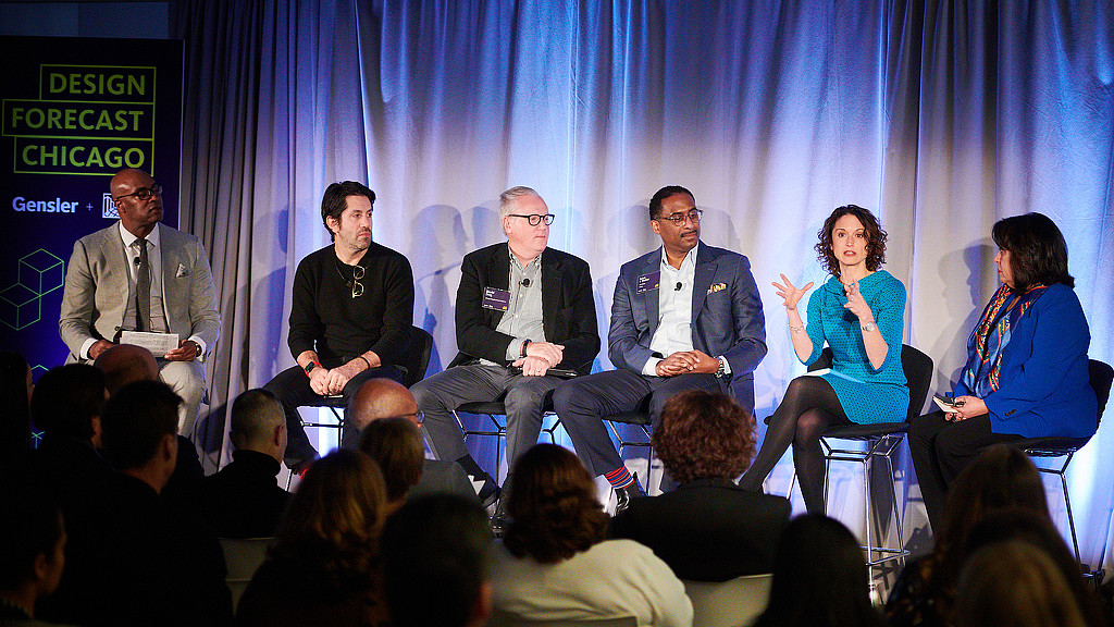 A group of people sitting in chairs.