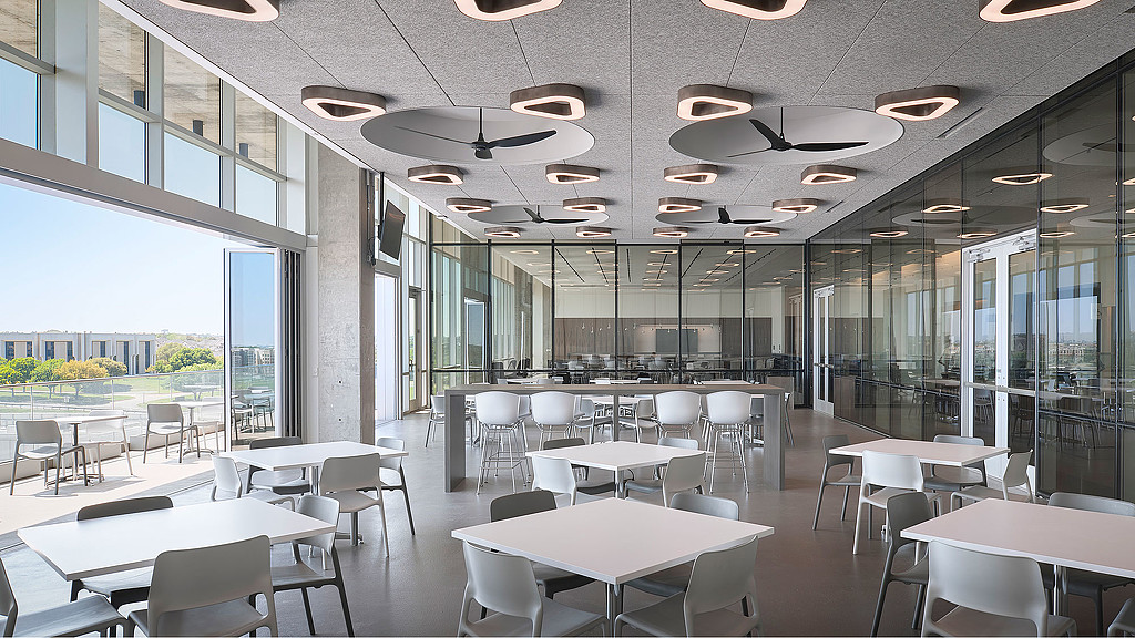 A room with tables and chairs.