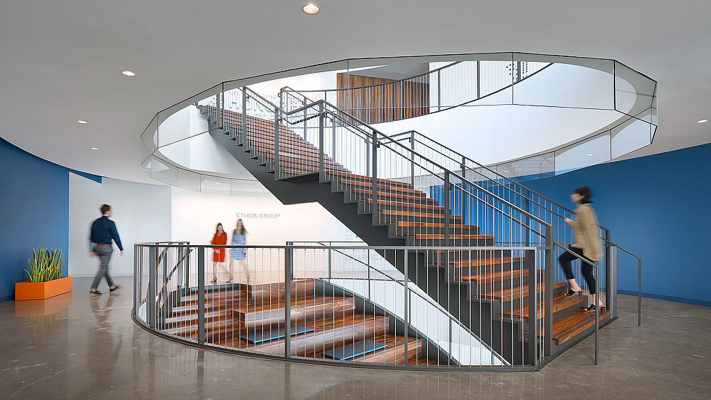 People walking up a staircase.