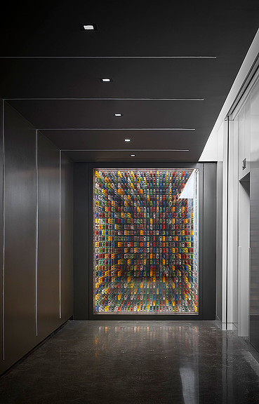 A large colorful painting on a wall.