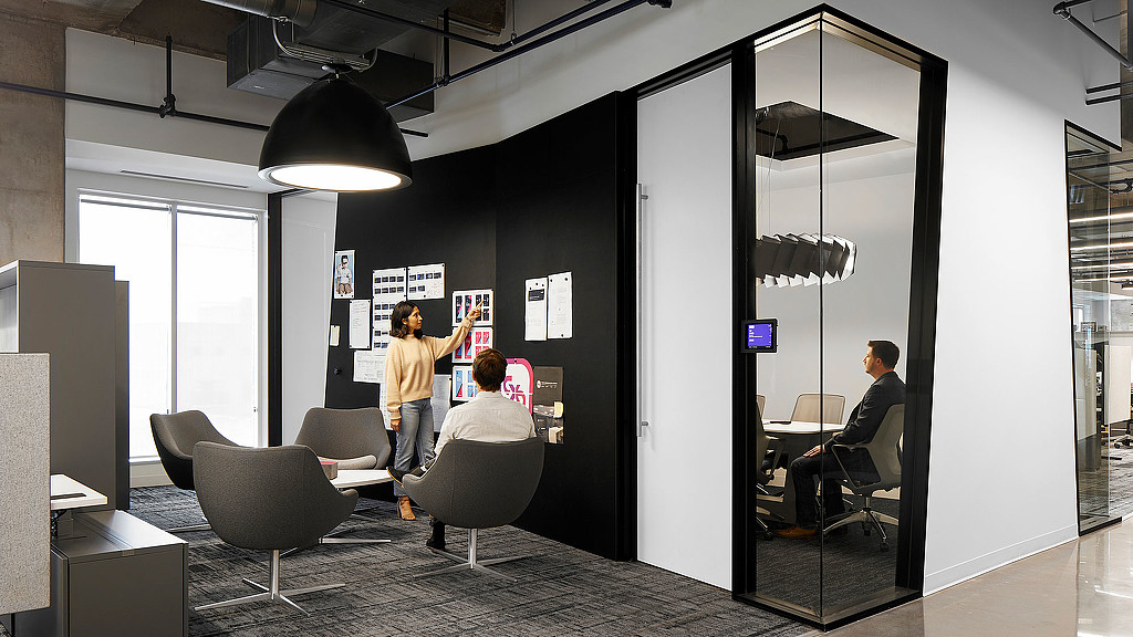 A group of people in an office.