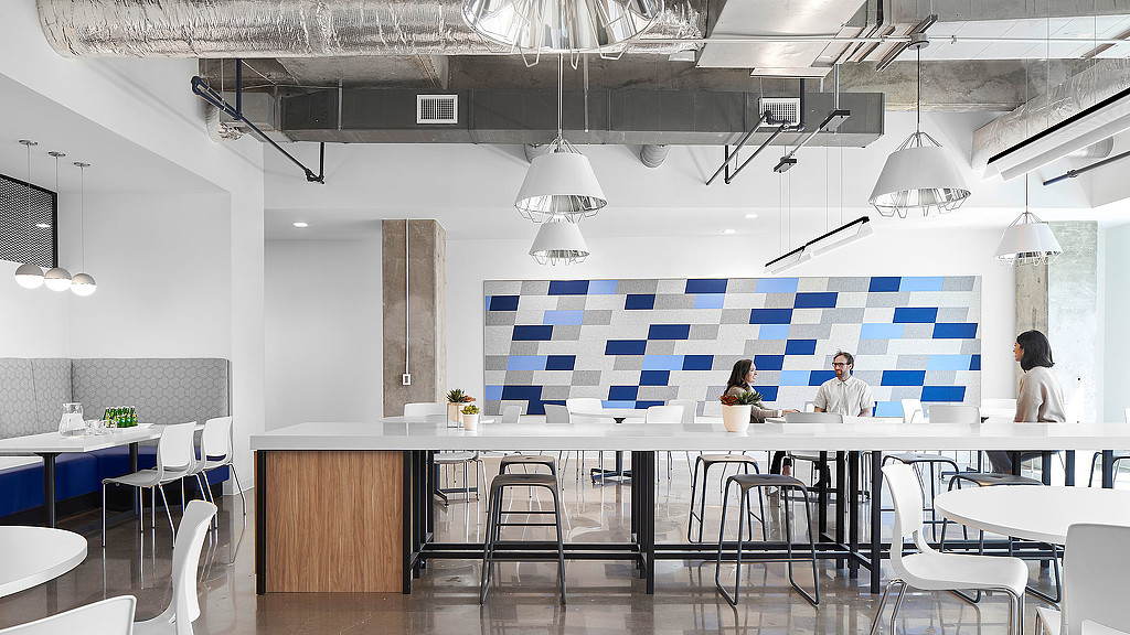 A room with tables and chairs.