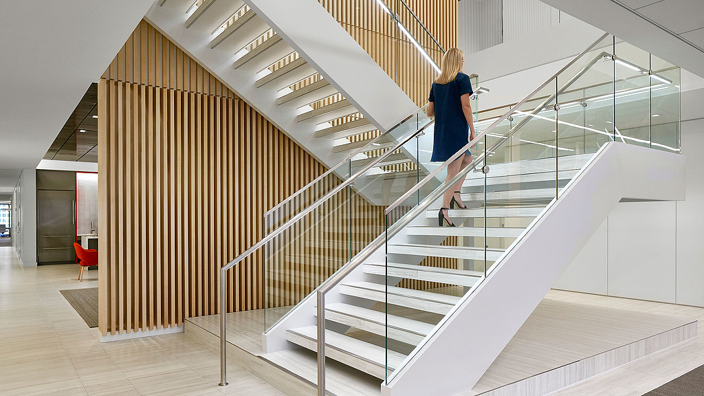 A person walking up a flight of stairs.