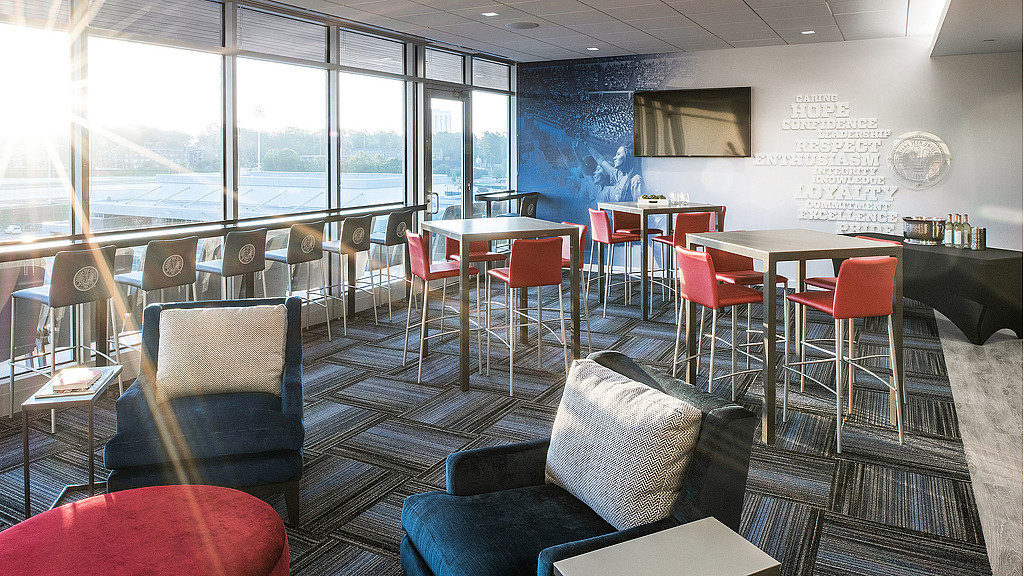 A room with tables and chairs.