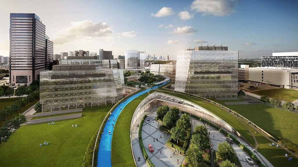 A large building with a pool in front of it.