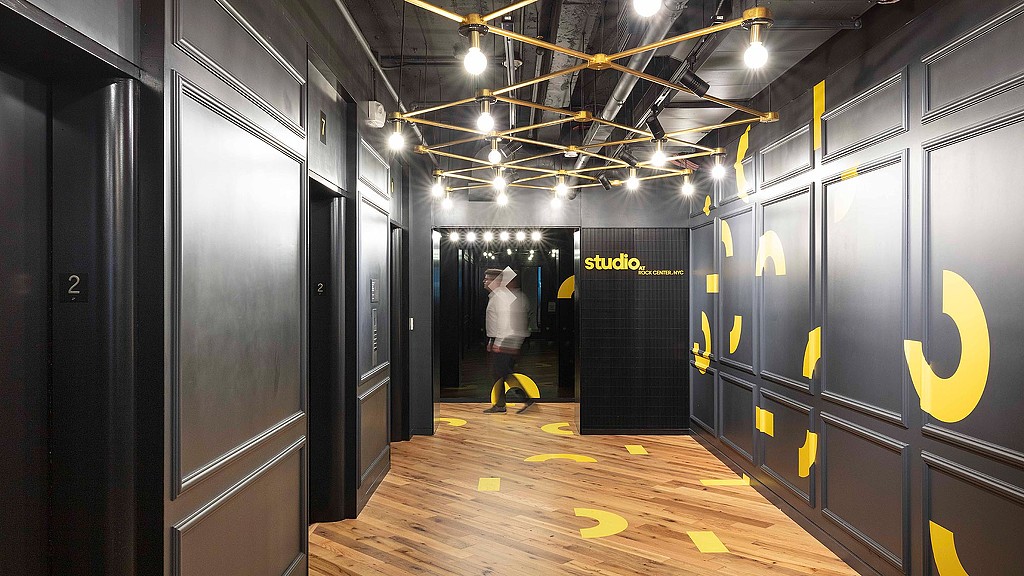 A person walking through a server room.