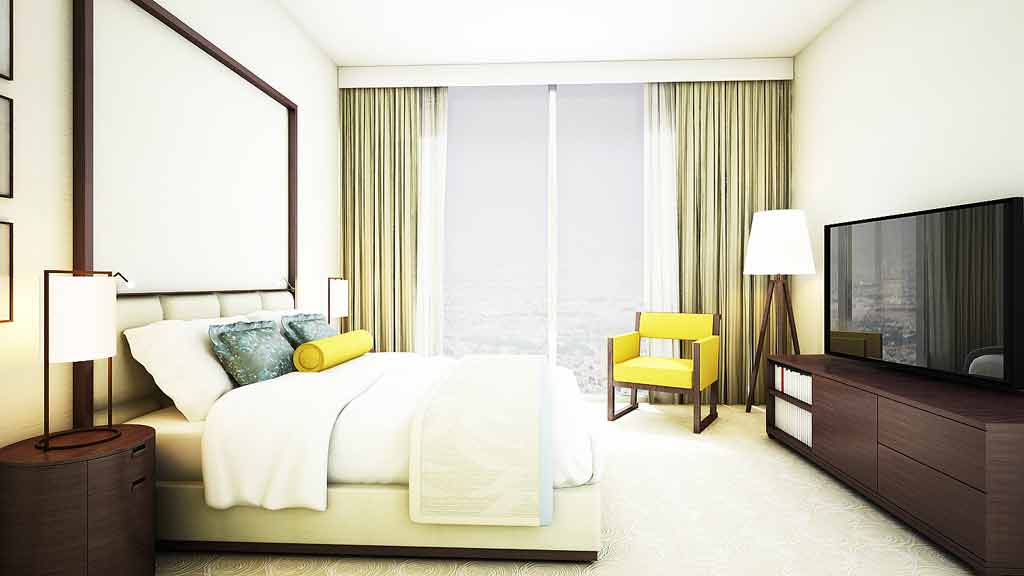 A bedroom with a bed and a tv.