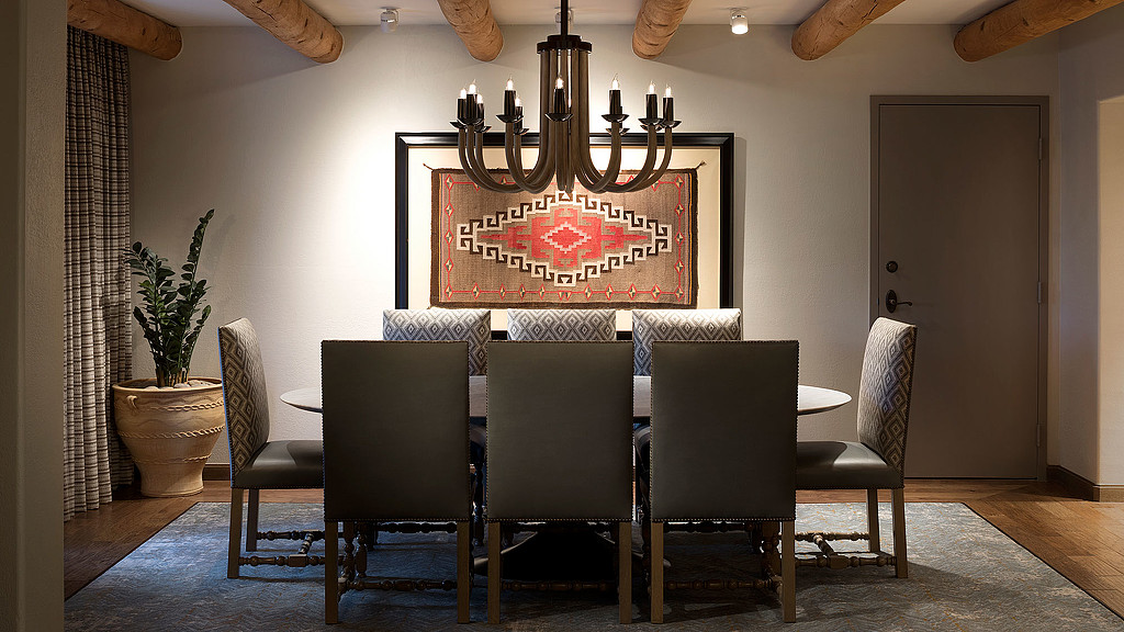 A table with chairs around it.