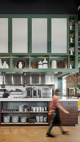 A person in a kitchen.