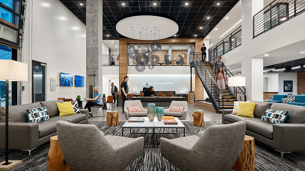A living room with a staircase.