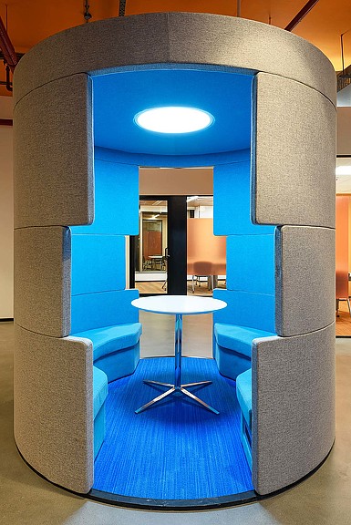 A room with a table and chairs.