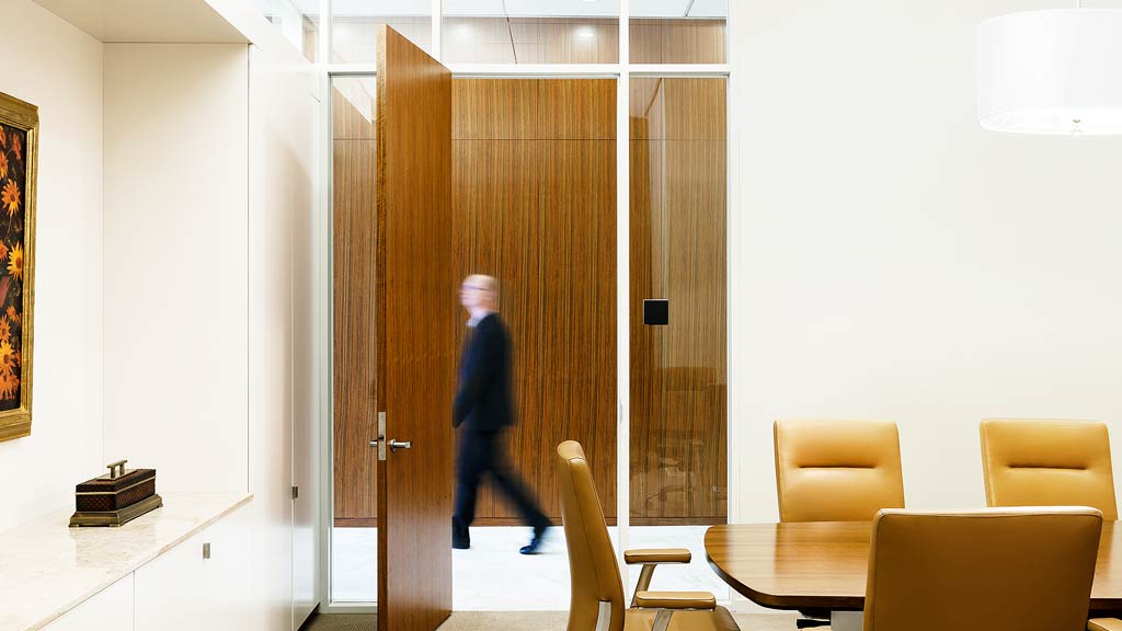 A person walking through a room.