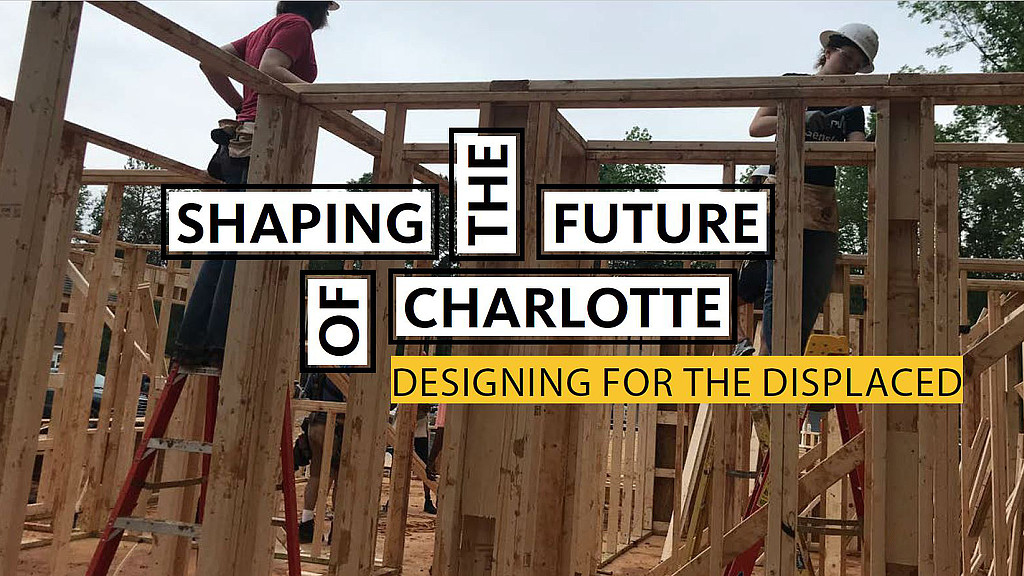 A couple of men constructing a house.