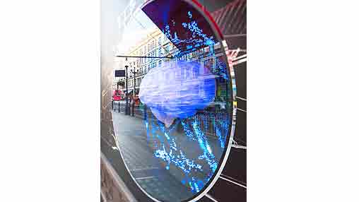 A large blue ball in a tunnel.