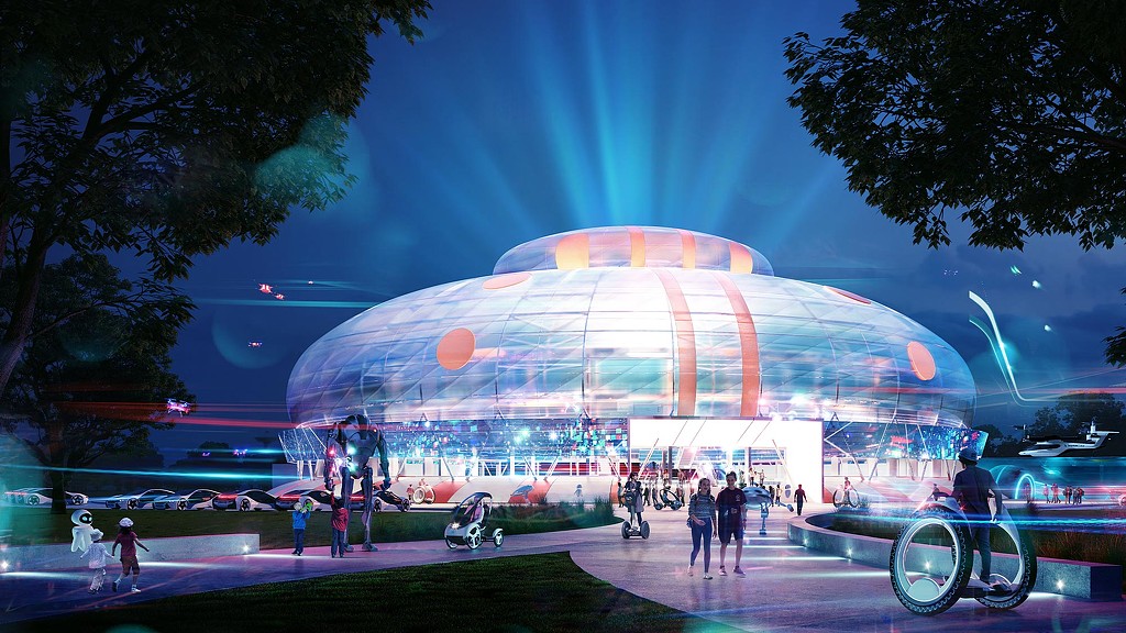 A large lit up building with people walking around.