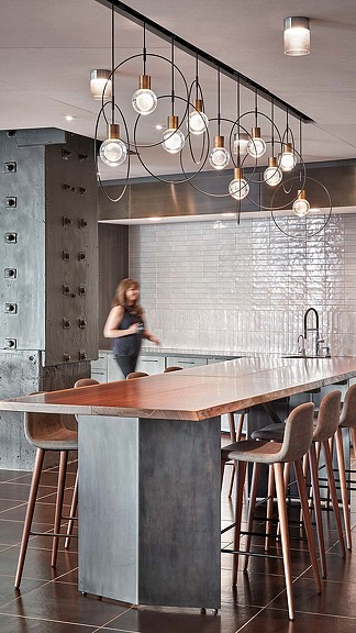A person standing in a kitchen.