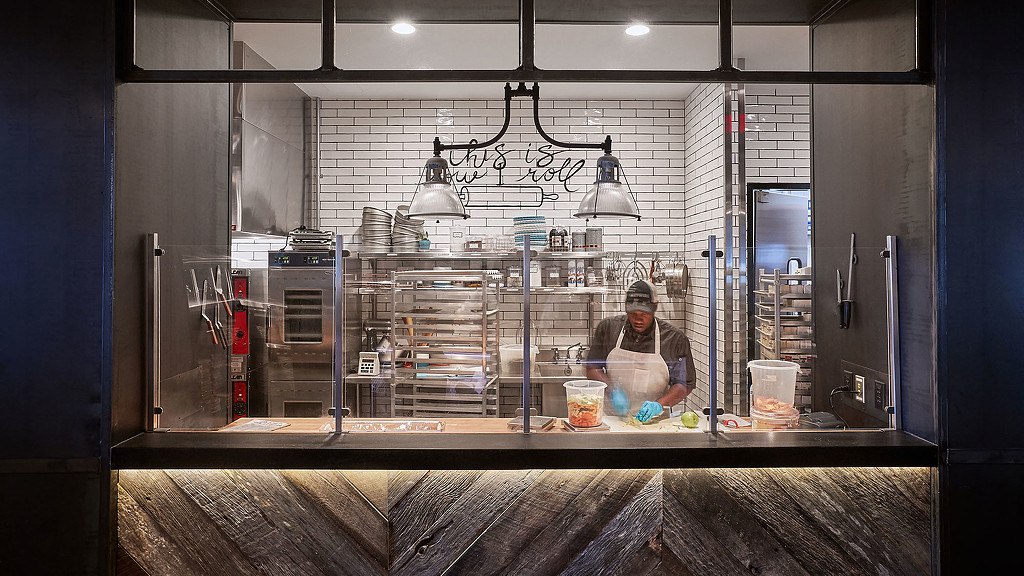 A person cooking in a kitchen.