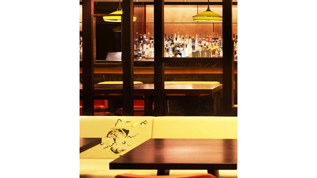 A bar with a table and chairs.