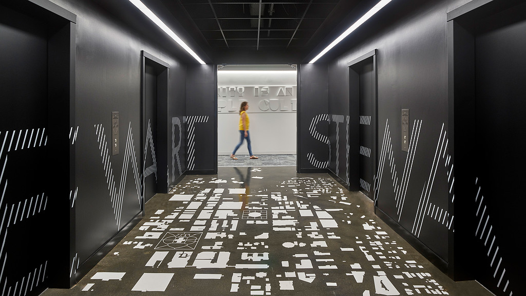 A person walking through a hallway.