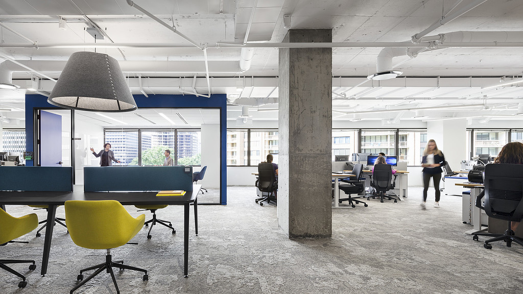 A room with tables and chairs.