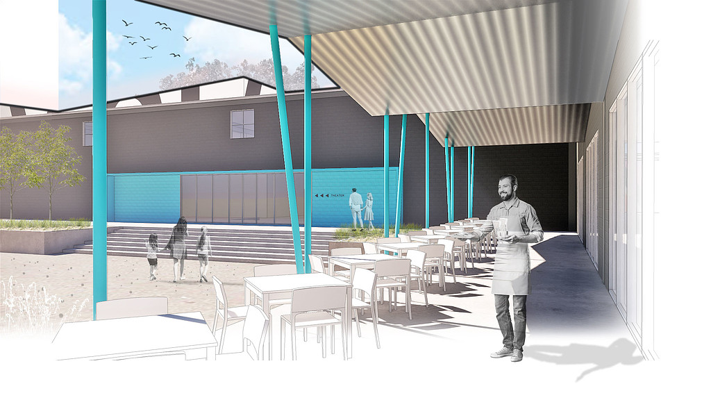 A person walking in a courtyard.