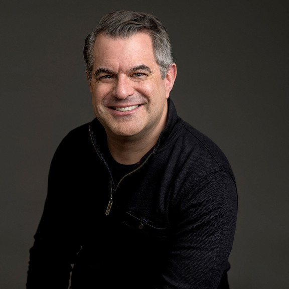 A man smiling for the camera.