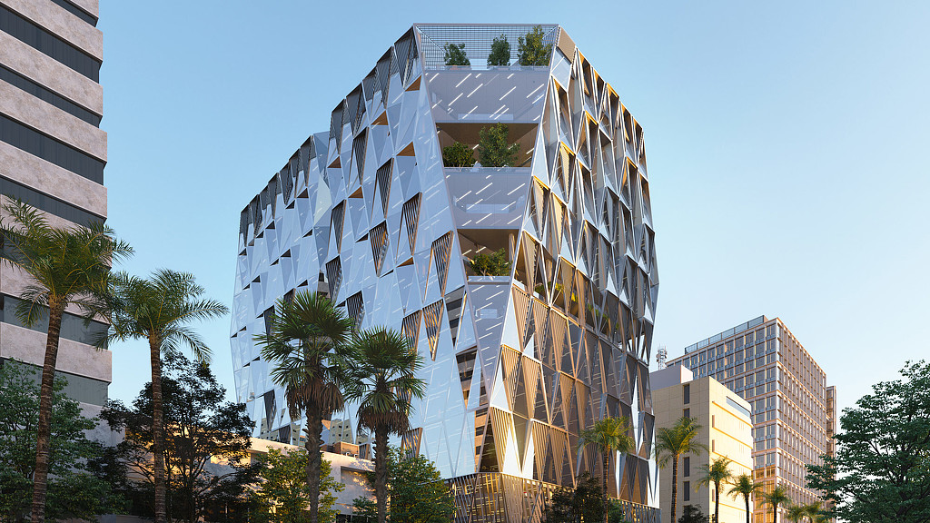 A tall building with trees in front of it.