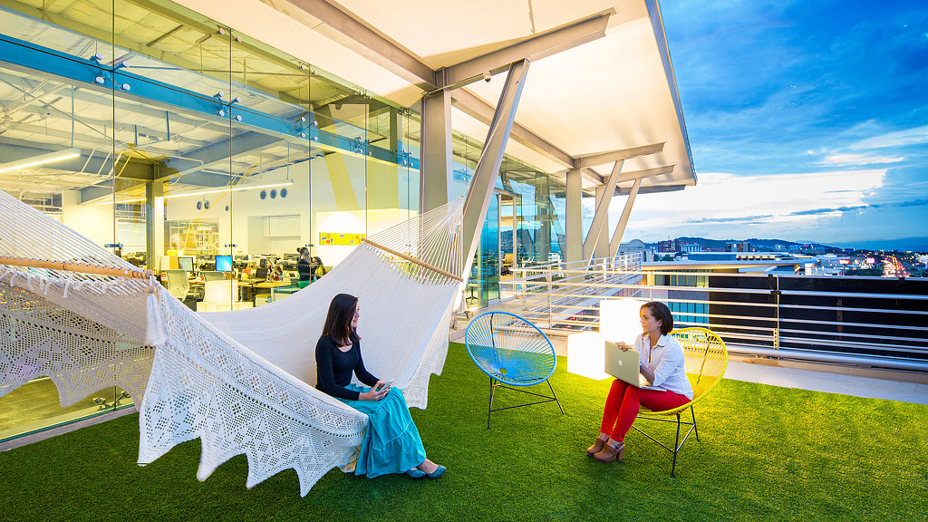 A couple of women sitting in chairs.
