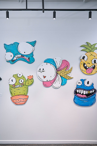 A group of cupcakes with faces drawn on them.