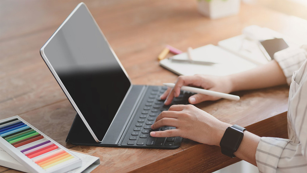 A person working on a laptop.