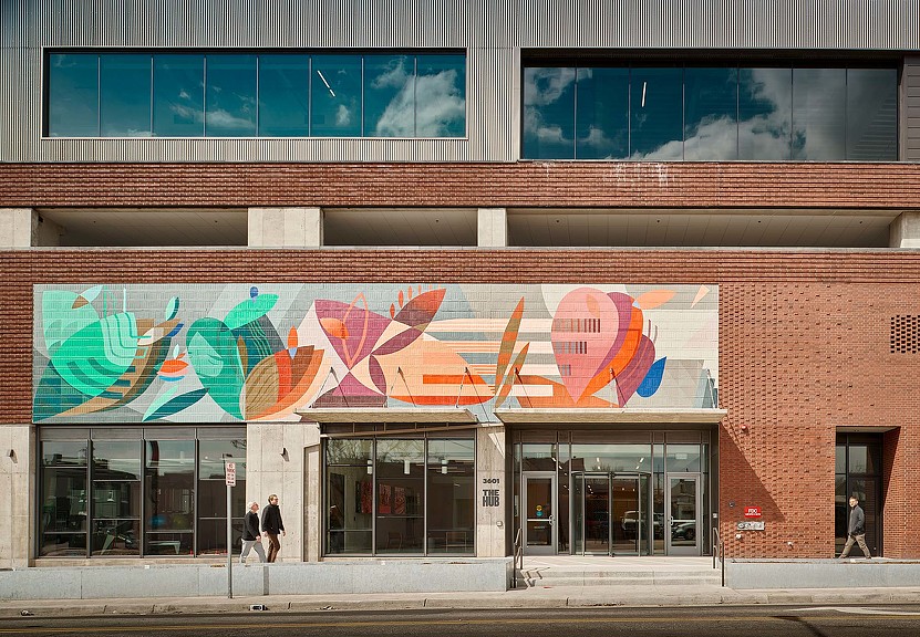 A building with a large mural on the side.