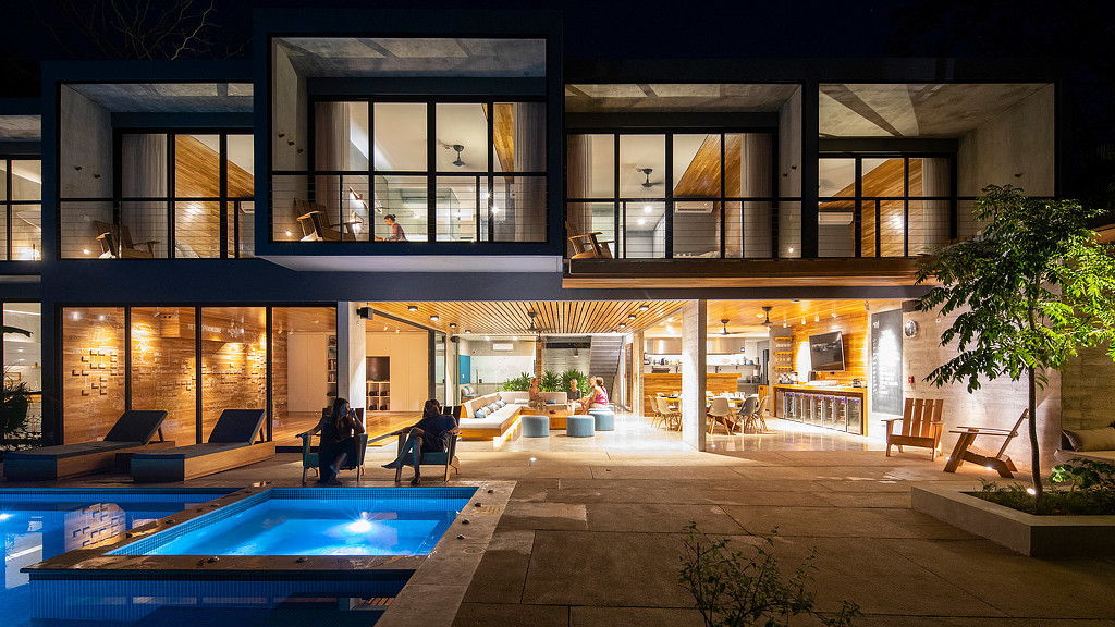 A building with a pool and a large window.