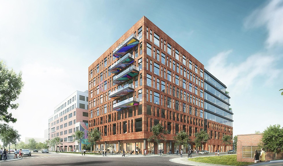 A large building with a street in front of it.