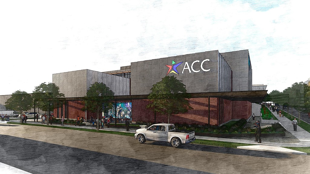 A white truck parked in front of a building with a large sign.